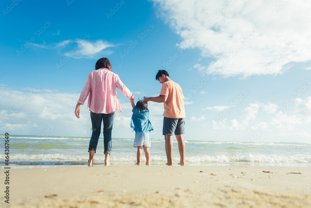 Happy young family Asian have fun on beach. Young family on vacation have a lot of fun Happy young family Asian have fun on beach. Young family on vacation have a lot of fun