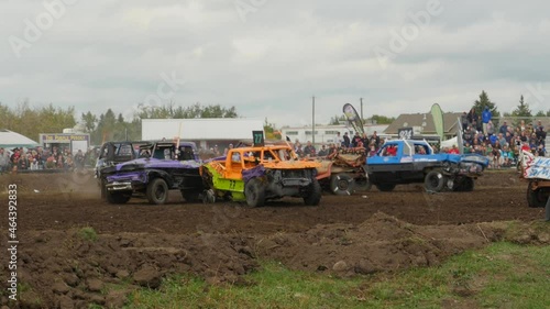 Trucks smashing into each other at demolition derby photo