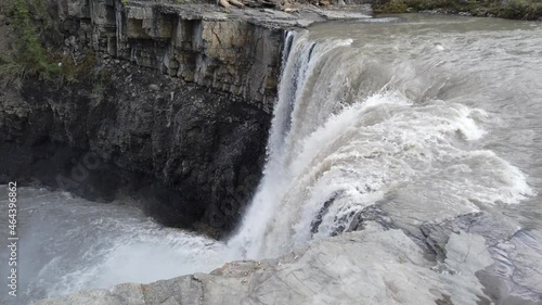 Water flows over Crescent Falls in the Alberta Rocky Mountains photo