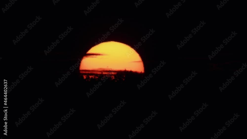 Sunrise closeup hot air distorted atmospheric effect wobbly image Sunrise closeup hot air distorted atmospheric effect wobbly image