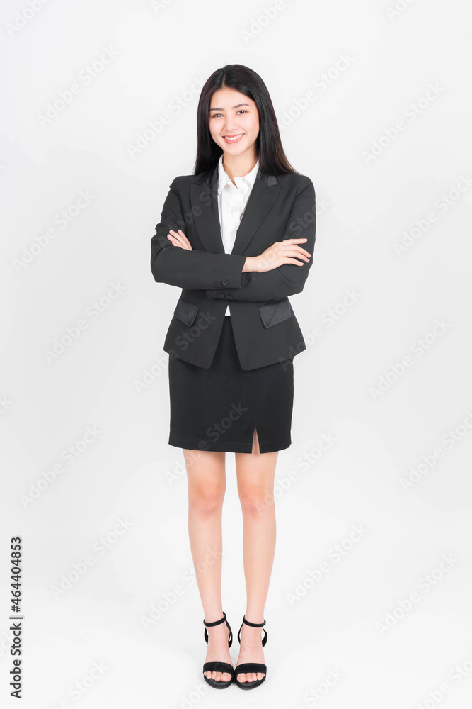 Full length portrait of a business woman , beautiful Asian girl whit suit standing arms crossed isolated on white background , business people concept Full length portrait of a business woman , beautiful Asian girl whit suit standing arms crossed isolated on white background , business people concept