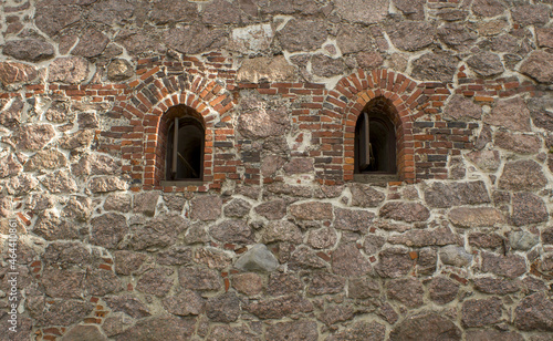 Old stone wall with two windows