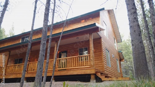 A time-lapse of a cabin in the woods as the shadows pass over it throughout the day.  photo