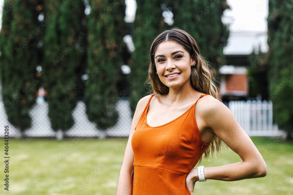 portrait of young Latin woman smiling in park in Mexico Latin America portrait of young Latin woman smiling in park in Mexico Latin America