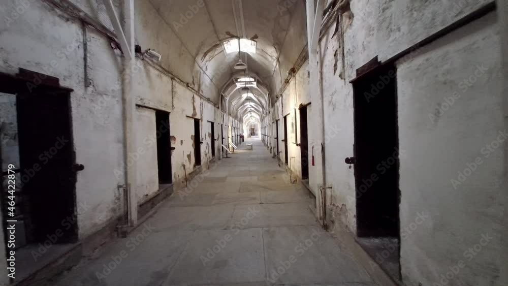 Moving shot of prison corridor past cells at Eastern State Penitentiary. Moving shot of prison corridor past cells at Eastern State Penitentiary.