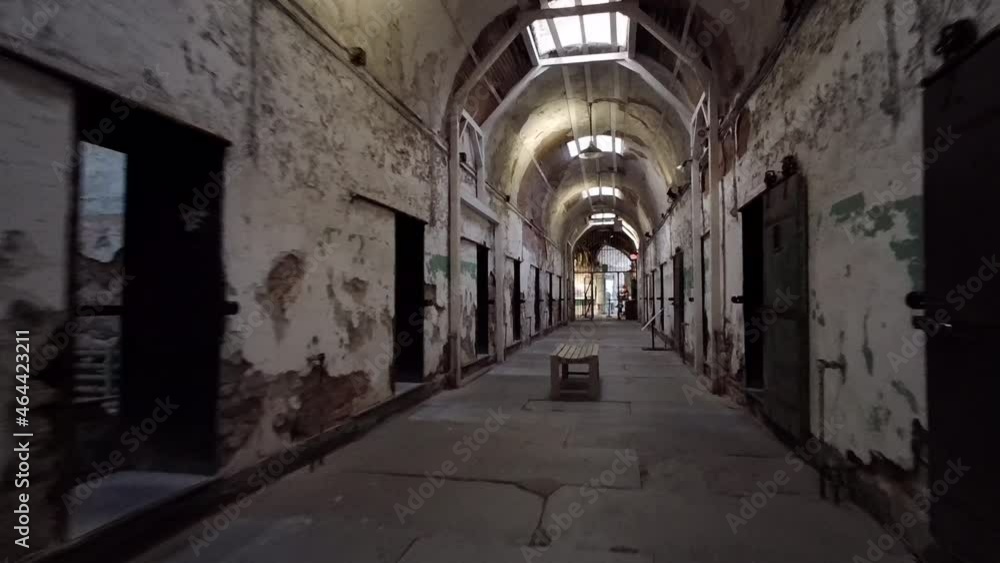 Camera moves down decrepit corridor of cellblock at Eastern State Penitentiary. Camera moves down decrepit corridor of cellblock at Eastern State Penitentiary.
