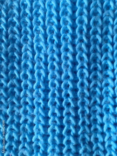 blue knitted background. pigtail texture