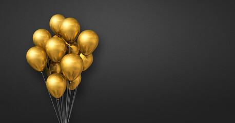 Gold balloons bunch on a black wall background. Horizontal banner.