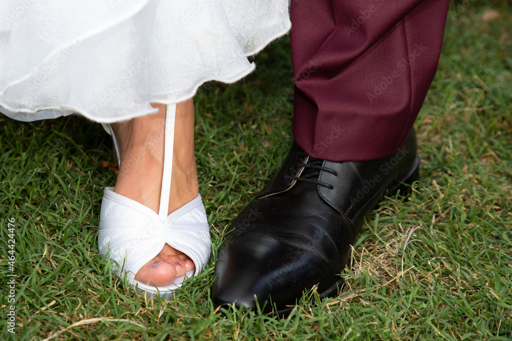 Feet shoes footwear of the groom and the bride closeup wedding