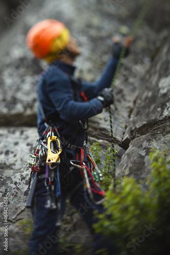 Abstract blurred image of a figure of a climber and climbing equipment.