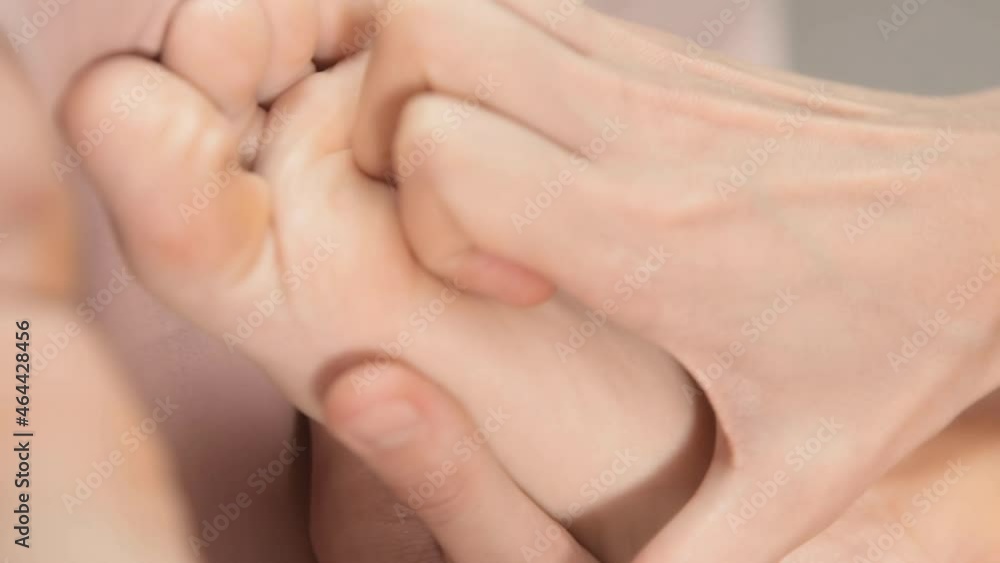 Close up reflexology foot massage. Professional therapist giving leg and foot massage to a woman in spa. Female massage therapist massaging clients legs. Body relaxation and skin care Close up reflexology foot massage. Professional therapist giving leg and foot massage to a woman in spa. Female massage therapist massaging clients legs. Body relaxation and skin care