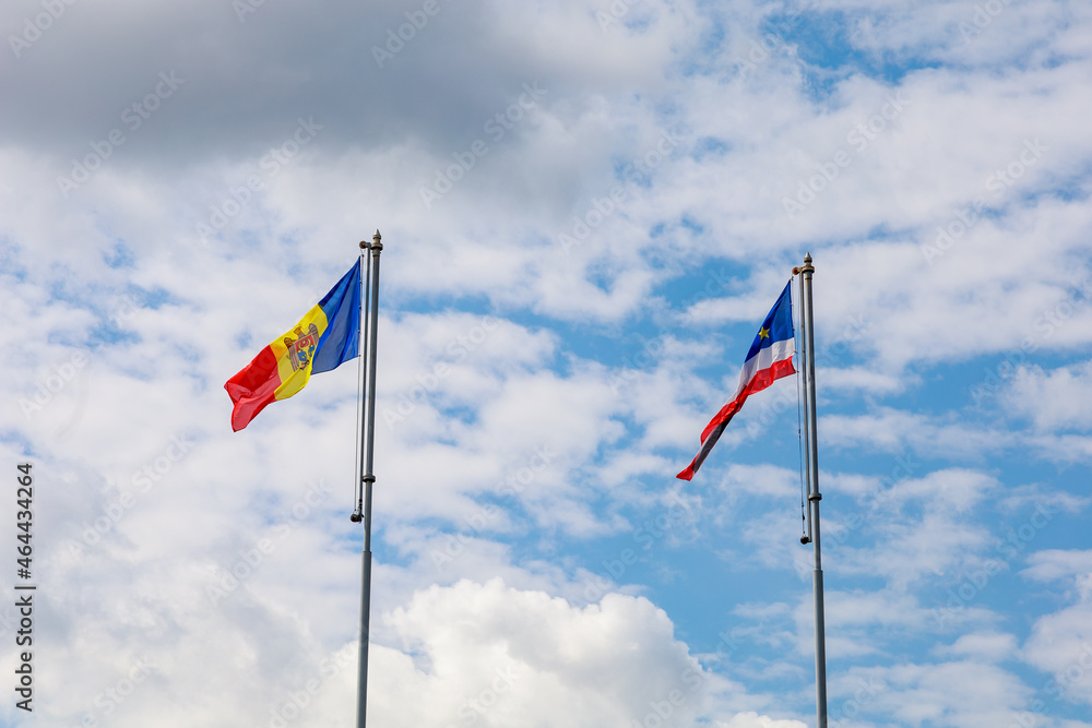 The flag of Moldova and the flag of Gagauzia against the sky