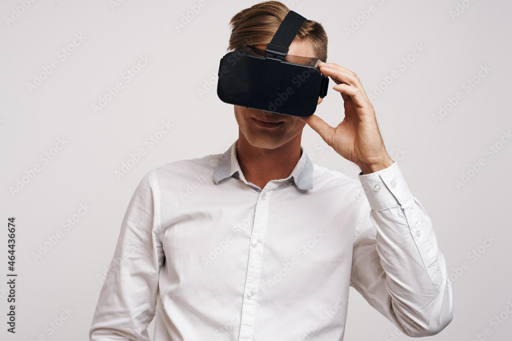 Cheerful man virtual reality glasses high-tech simulator technology studio Cheerful man virtual reality glasses high-tech simulator technology studio