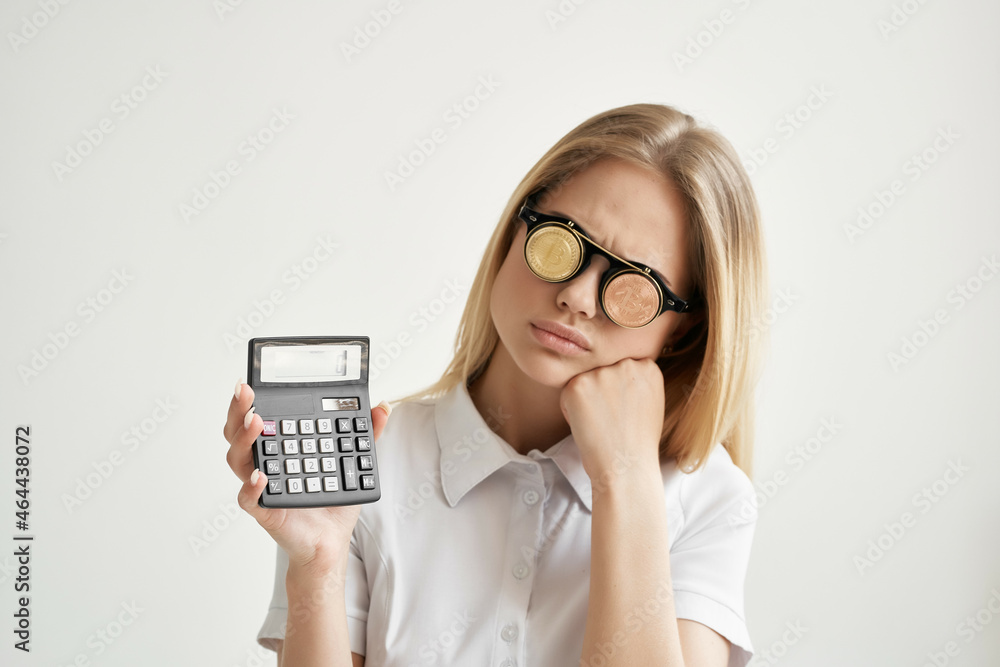 Businesswoman calculator in hand and bitcoin isolated background Businesswoman calculator in hand and bitcoin isolated background