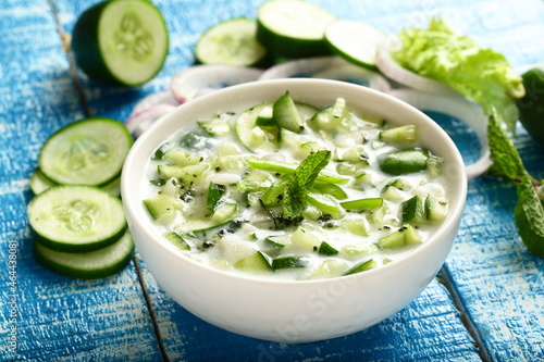 Bowl of delicious yogurt raitha salad with cucumber and onions.