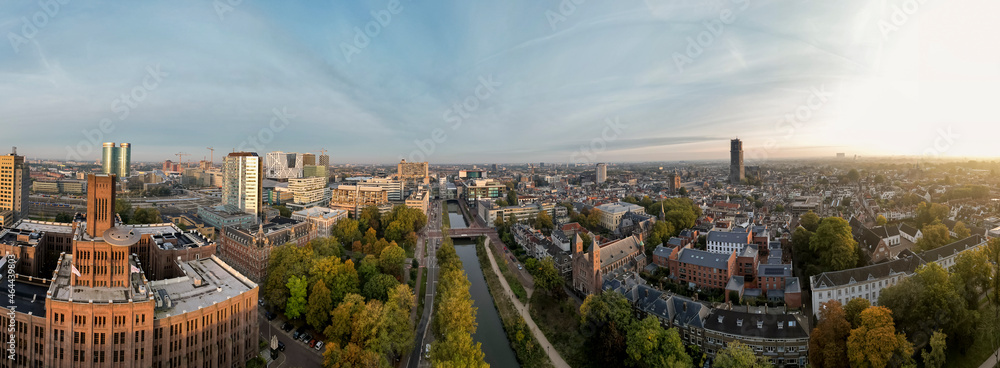 Wide 360 degrees panoramic aerial view of the medieval Dutch centre of Utrecht with Inktpot building and cathedral towering over the city at early morning sunrise. Cityscape in The Netherlands