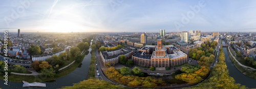 Super wide 360 degrees panoramic aerial view of the medieval Dutch centre of Utrecht with Inktpot building and cathedral towering over the city at early morning sunrise. Cityscape in The Netherlands photo