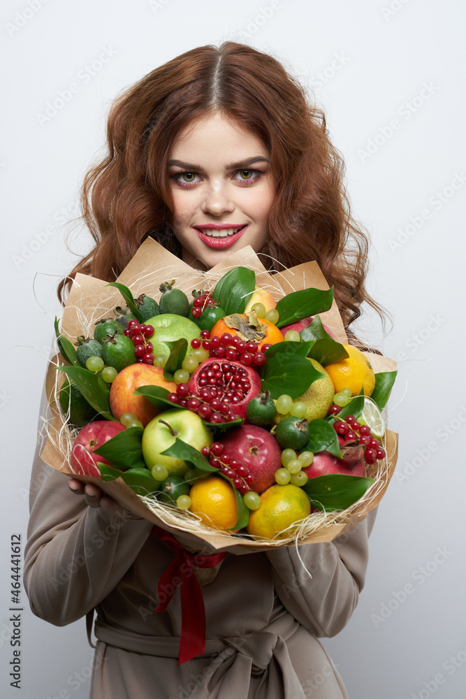 pretty woman bright makeup attractive look a bouquet of fruits light background pretty woman bright makeup attractive look a bouquet of fruits light background