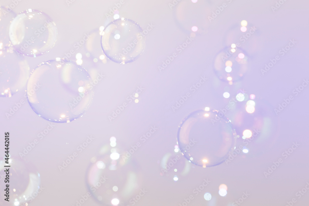 Beautiful Transparent Soap Bubbles on Purple Background