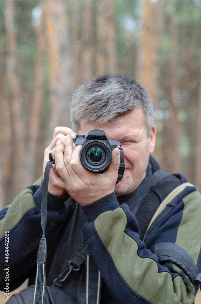 Portrait of a Photographer. A middle-aged man looks into the cam Portrait of a Photographer. A middle-aged man looks into the cam