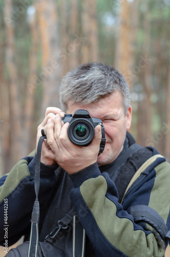Portrait of a Photographer. A middle-aged man looks into the cam © Mikhail
