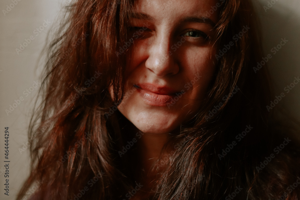 Portrait of a beautiful woman close-up. Woman face, sensual lips, natural beauty. Red brown hair Portrait of a beautiful woman close-up. Woman face, sensual lips, natural beauty. Red brown hair