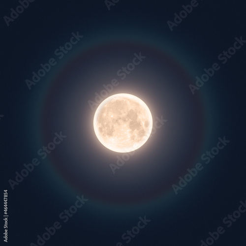 Full moon in night with halo