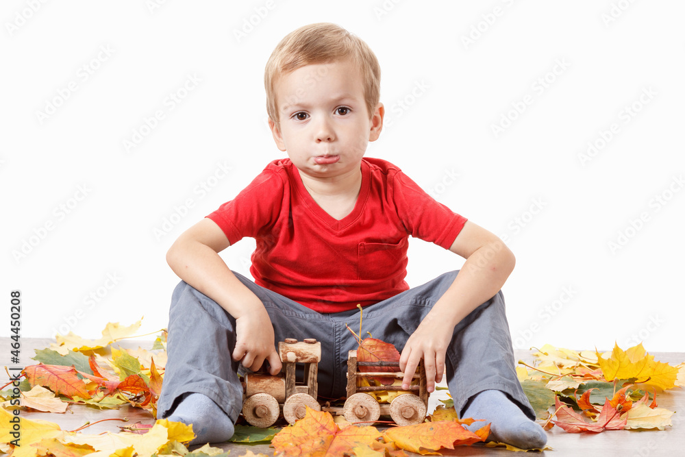 Portrait of a boy with toy train on white Portrait of a boy with toy train on white