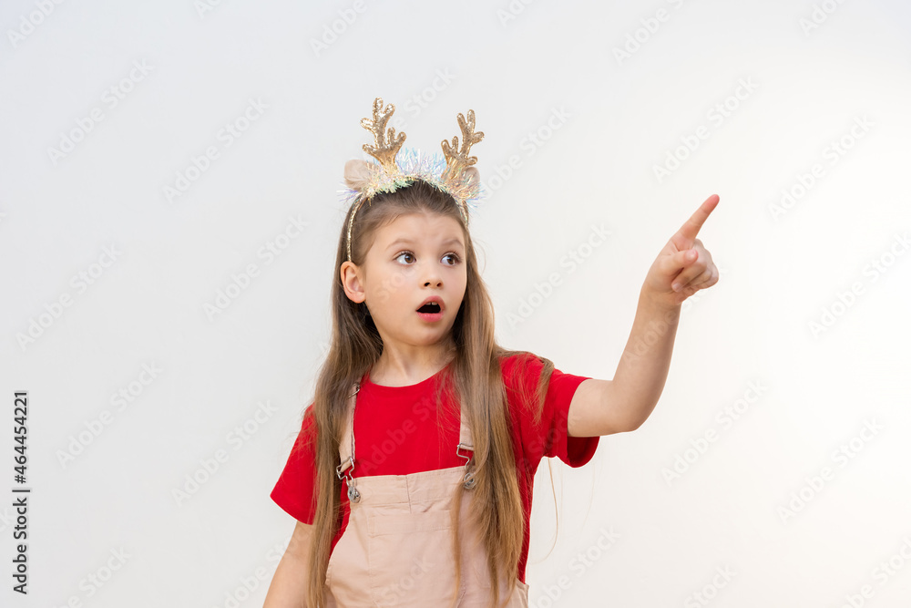 The child points his finger to the side. The child points his finger to the side.