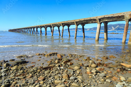 The historic wharf at Tokomaru Bay  New Zealand  built in the 1940s. The wharf s remarkable length is due to the shallowness of the bay 