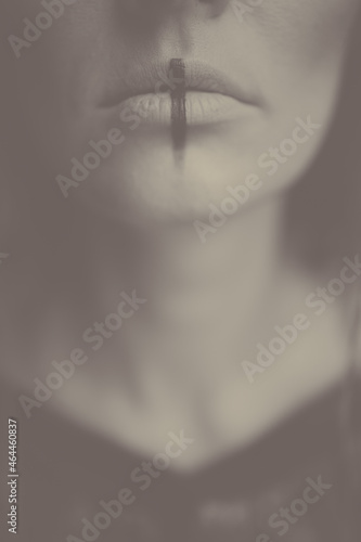 Halloween mystical mood background. Lips with an occult sign close-up. Celtic mythology. Witch makeup. Blurred strange atmosphere. Witchcraft mysticism magic.