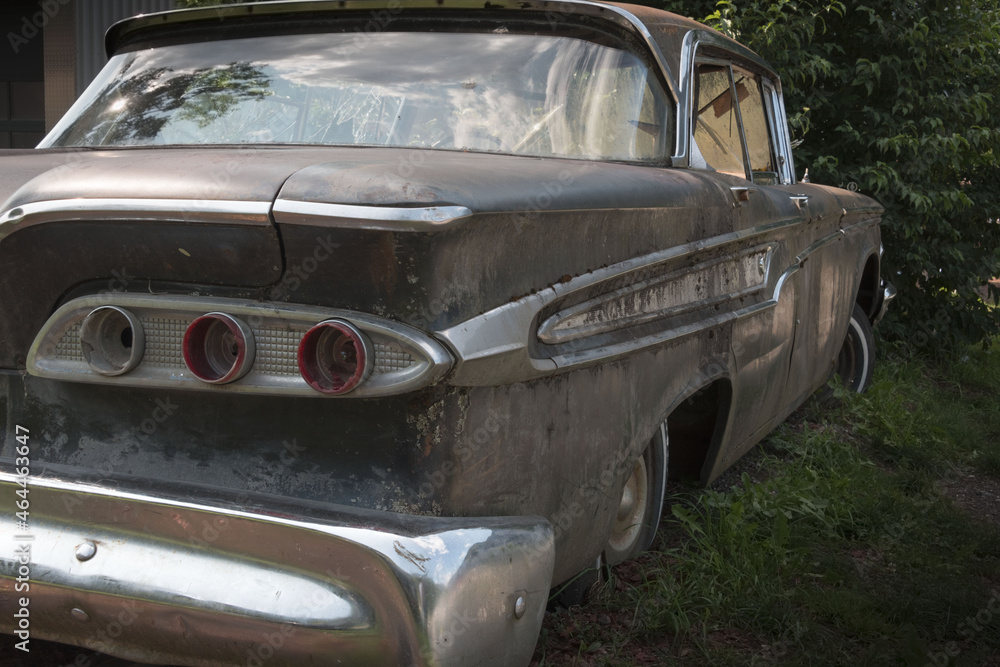 old rusted American car with bumper and taillights