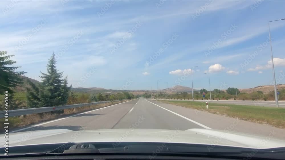 car driving by speedway sunny summer day car driving by speedway sunny summer day