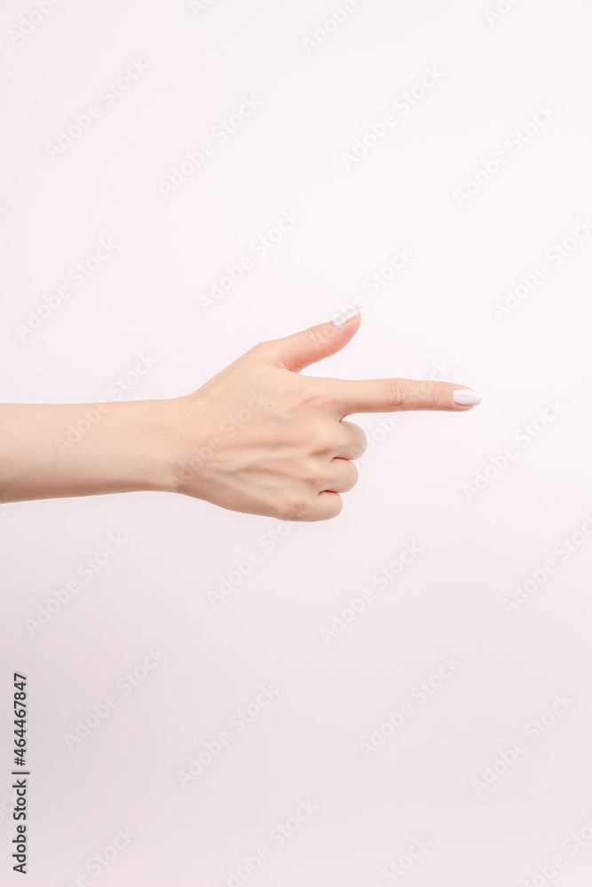 Scissors-shaped hand in front of the white background Scissors-shaped hand in front of the white background
