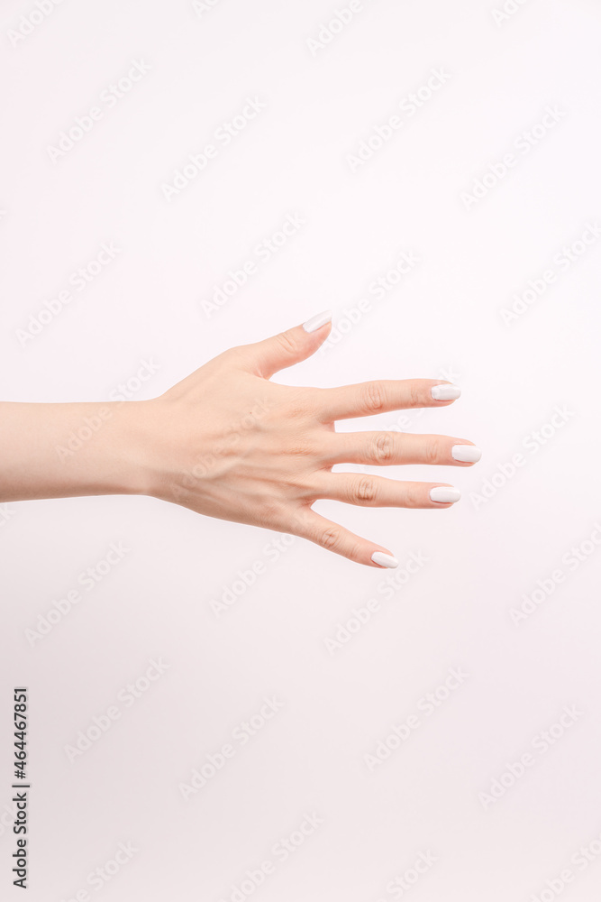 hand showing number five In front of the white background