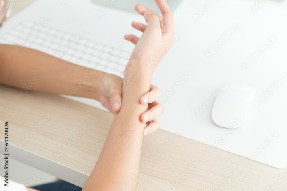 Concept of office syndrome, woman having wrist pain from using computer, wrist pain. Concept of office syndrome, woman having wrist pain from using computer, wrist pain.