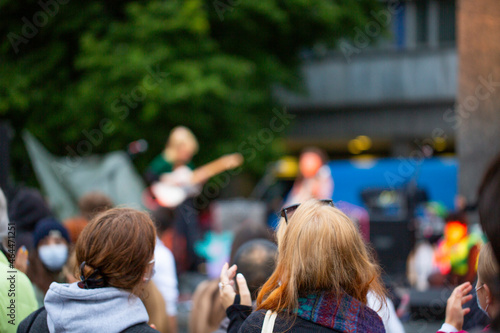 Fototapeta Naklejka Na Ścianę i Meble -  Crowd enjoying and clapping a street public rock concert