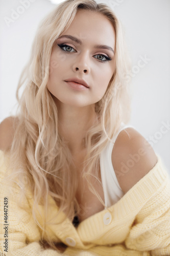Young beautiful blond woman portrait indoor 