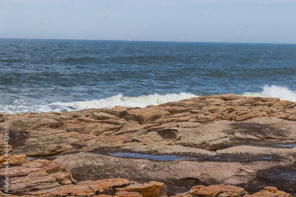 A rocky embankment on the coast of the sea in South Africa A rocky embankment on the coast of the sea in South Africa