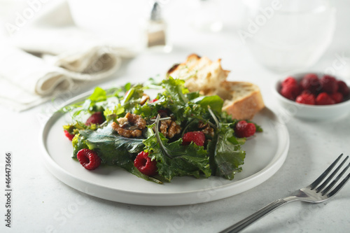 Healthy green salad with raspberry and walnut