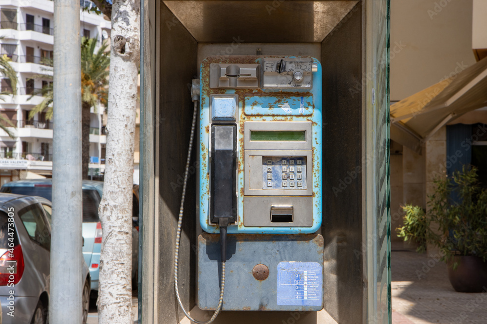 An original style telephone box in the streets of Ibiza on the Spanish Island An original style telephone box in the streets of Ibiza on the Spanish Island