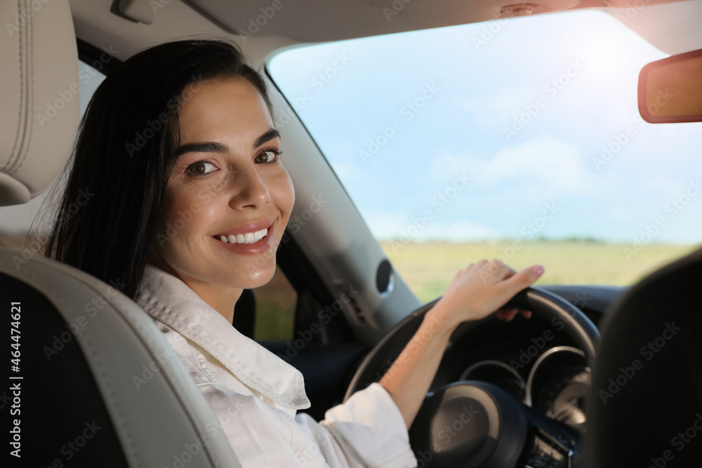 Beautiful young woman on driver's seat in modern car Beautiful young woman on driver's seat in modern car