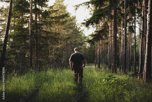 Ranger walking through his territory in the woods. Protection and preserving wilderness areas. 