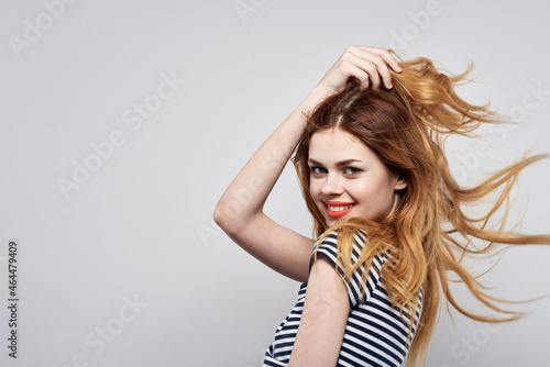 beautiful woman in a striped t-shirt gesture with his hands model studio