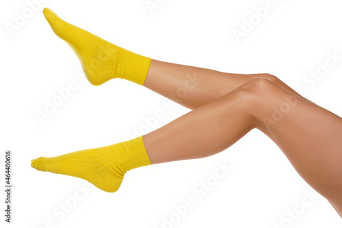 Pretty female legs in yellow short socks