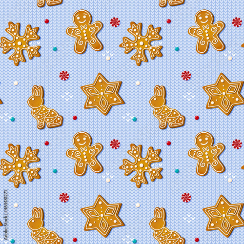 Christmas seamless pattern with gingerbread cookies on blue knitted background. Xmas homemade biscuits in shape of rabbit and gingerbread man, snowflake and star. Vector illustration