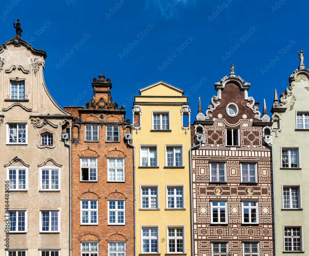 colorful house fronts of row houses on the riverfront of the Motlawa River in the Old Town of Gdansk
