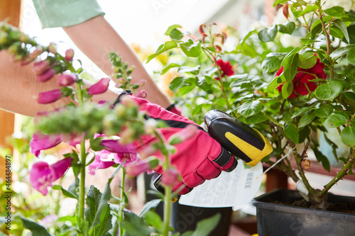 Gardener with barcode scanner during the inventory
