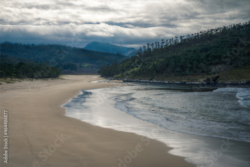 The waves cover a beach as the tide rises