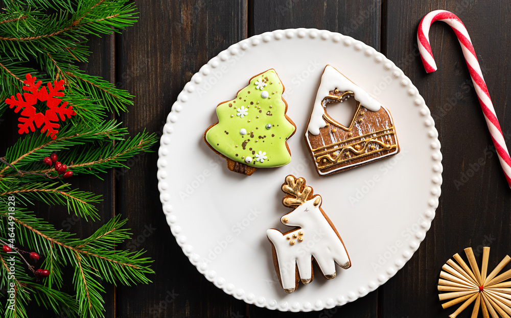 Christmas cookies on a plate on dark wooden background Christmas cookies on a plate on dark wooden background
